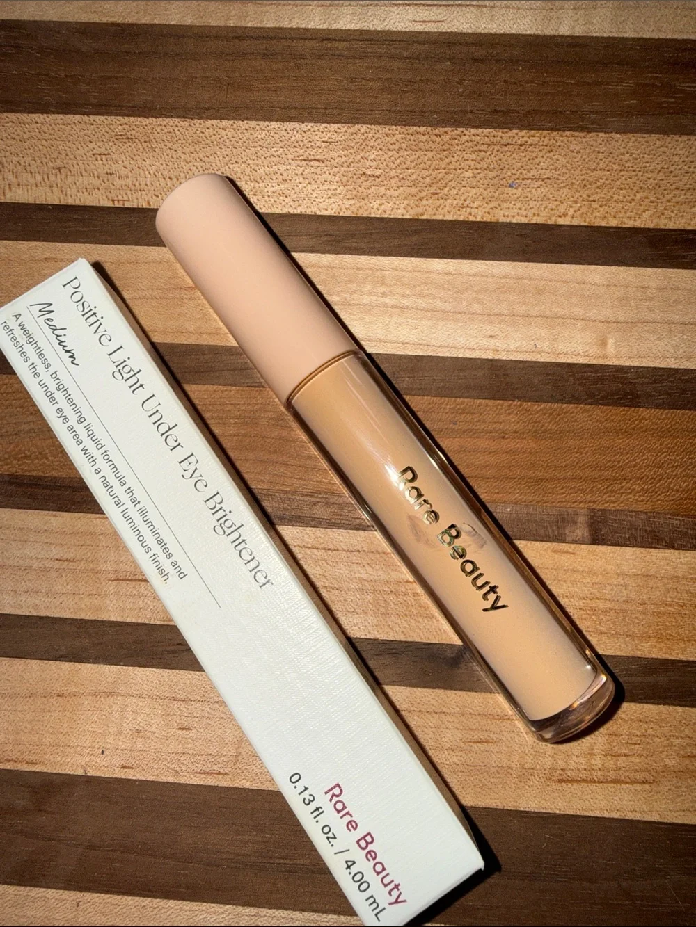 Rare Beauty Positive Light Eye Brightener - Light Cream with Pink Logo shade med